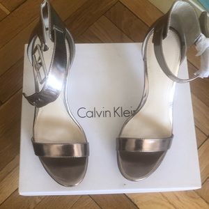 Sleek and sexy!  Calvin Klein metallic High heel shoes